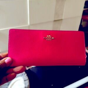 Coach pink wallet.